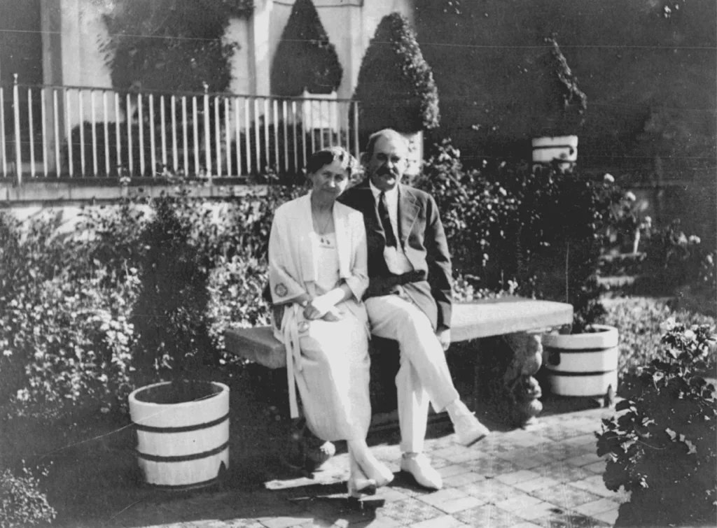 Dwight and Maie Bartlett Heard seated together in a garden