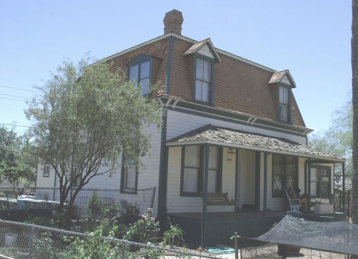 The Judge Charles Austin Tweed House, a historic Oakland home with a gambrel roof and wide porch