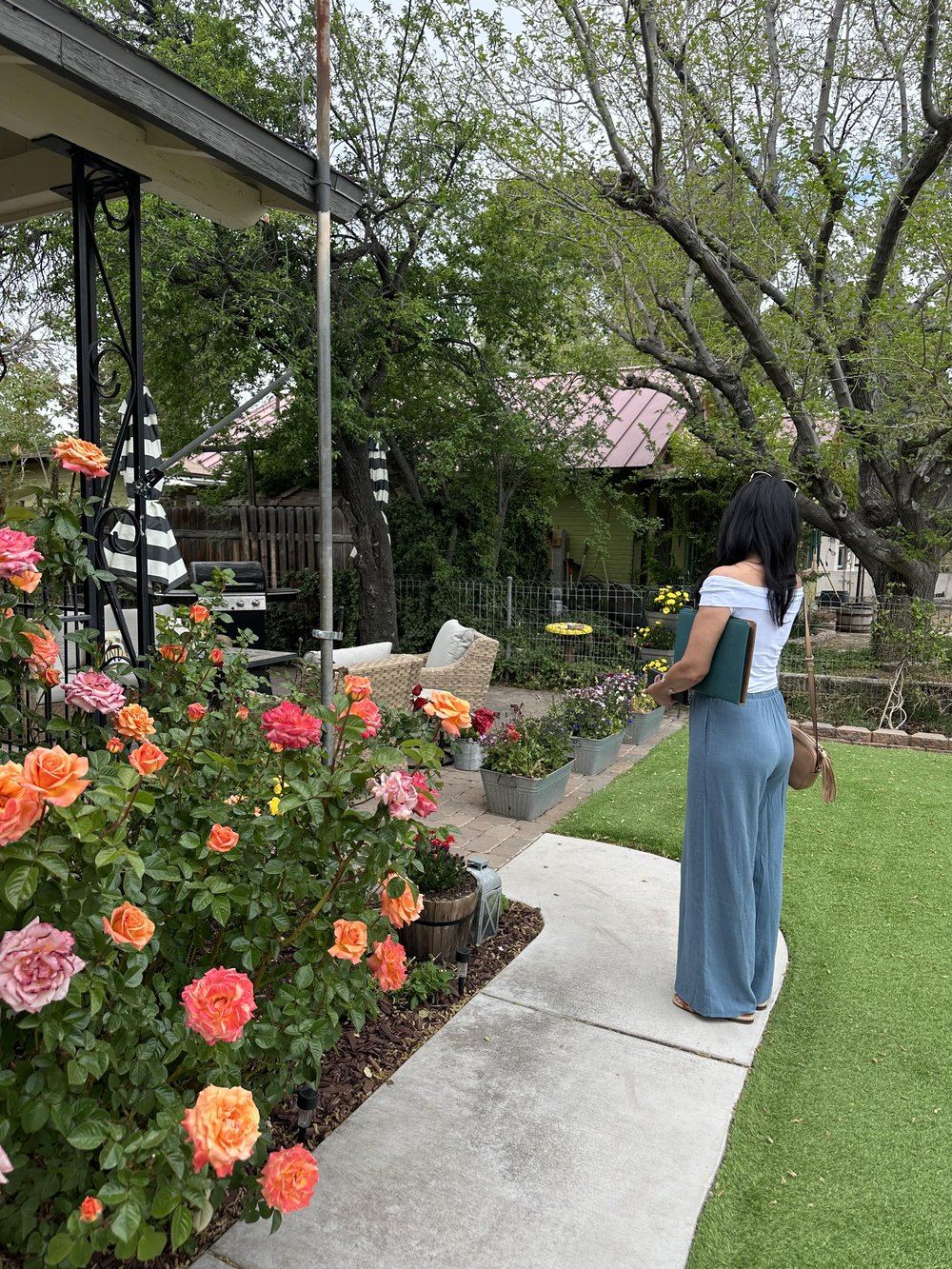 Destyn Moreno among roses in an Arizona garden