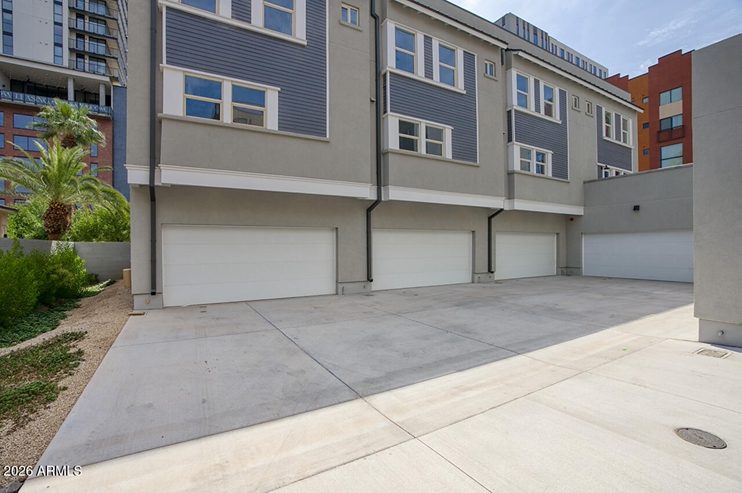 Garage-level street view of The Sculptor's Residence at 210 W McKinley Street, Phoenix