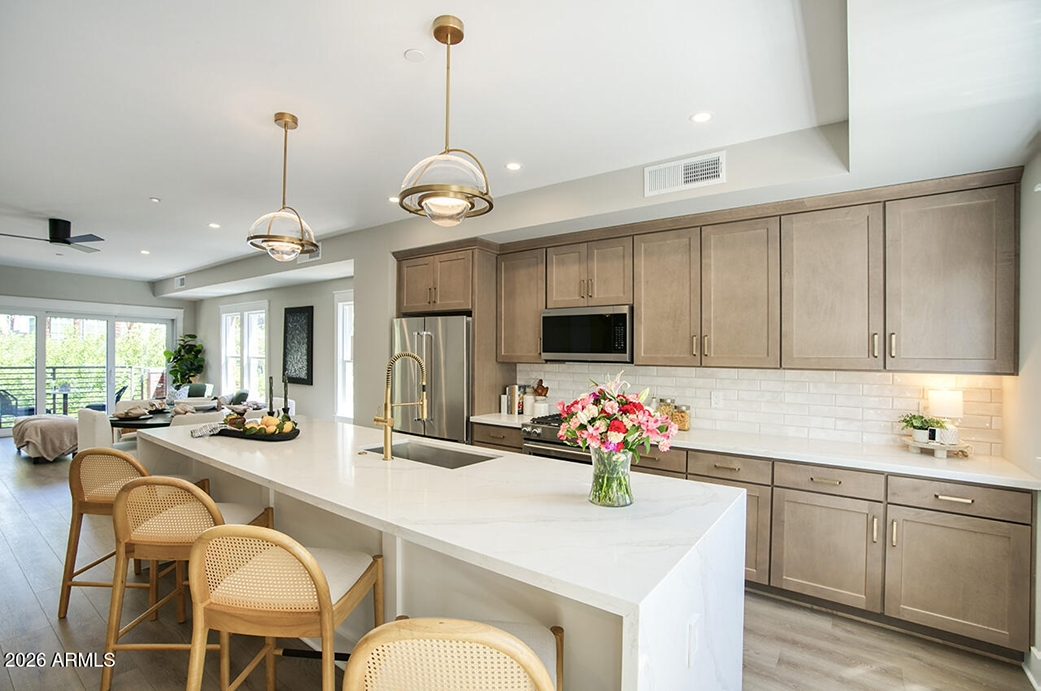 Island kitchen with quartz countertops at 804 N 2nd Avenue, Phoenix