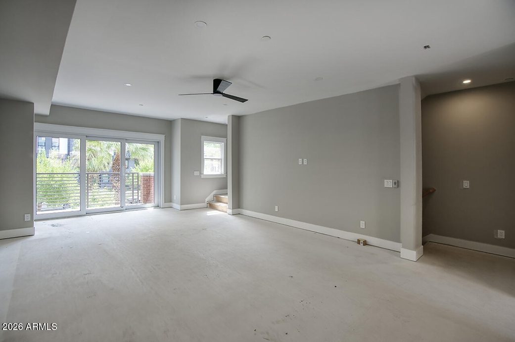 Great room with vaulted ceiling and large windows at 808 N 2nd Avenue