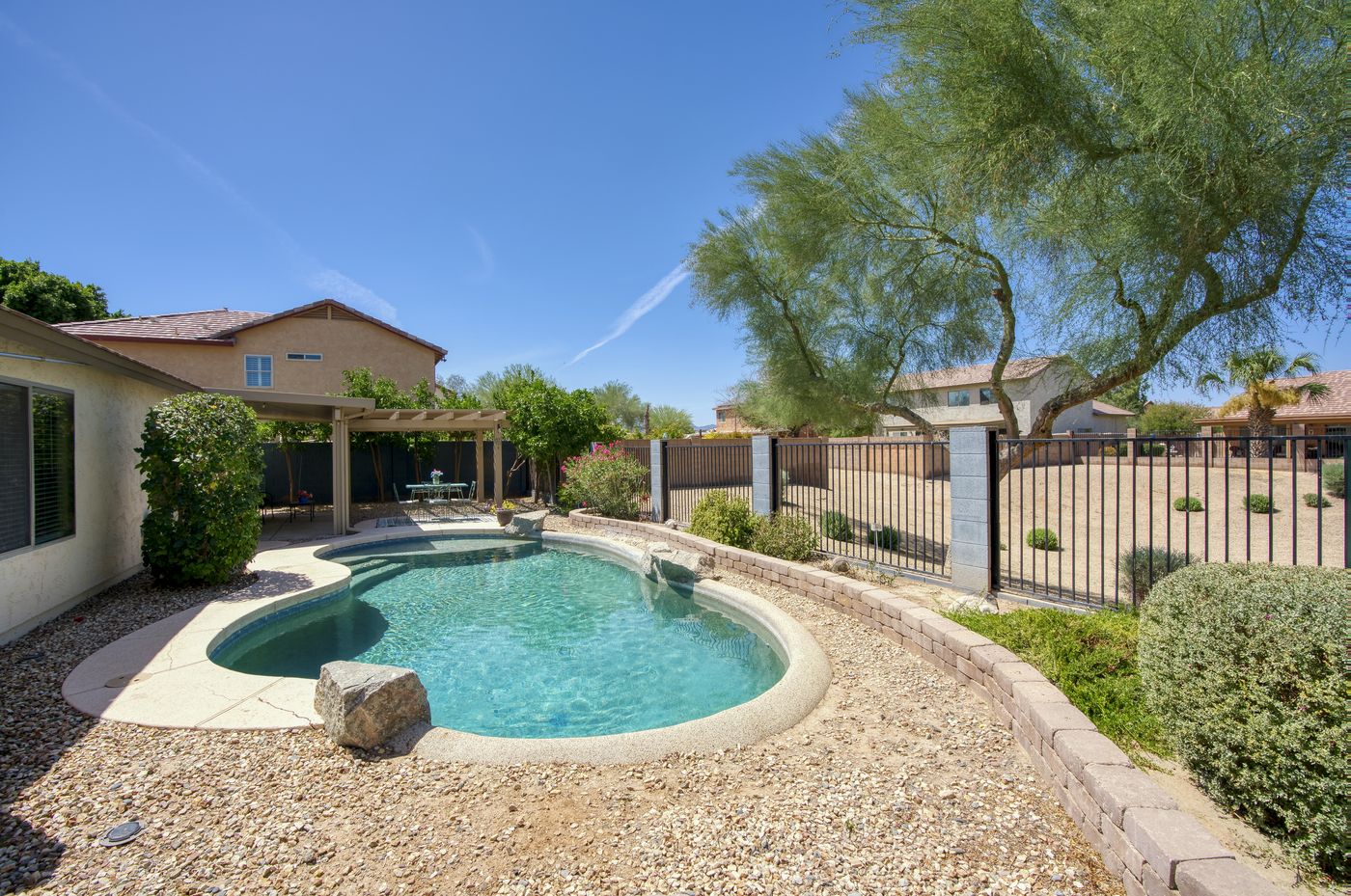 Backyard pool and covered patio view at 15968 W Jefferson Street, Goodyear