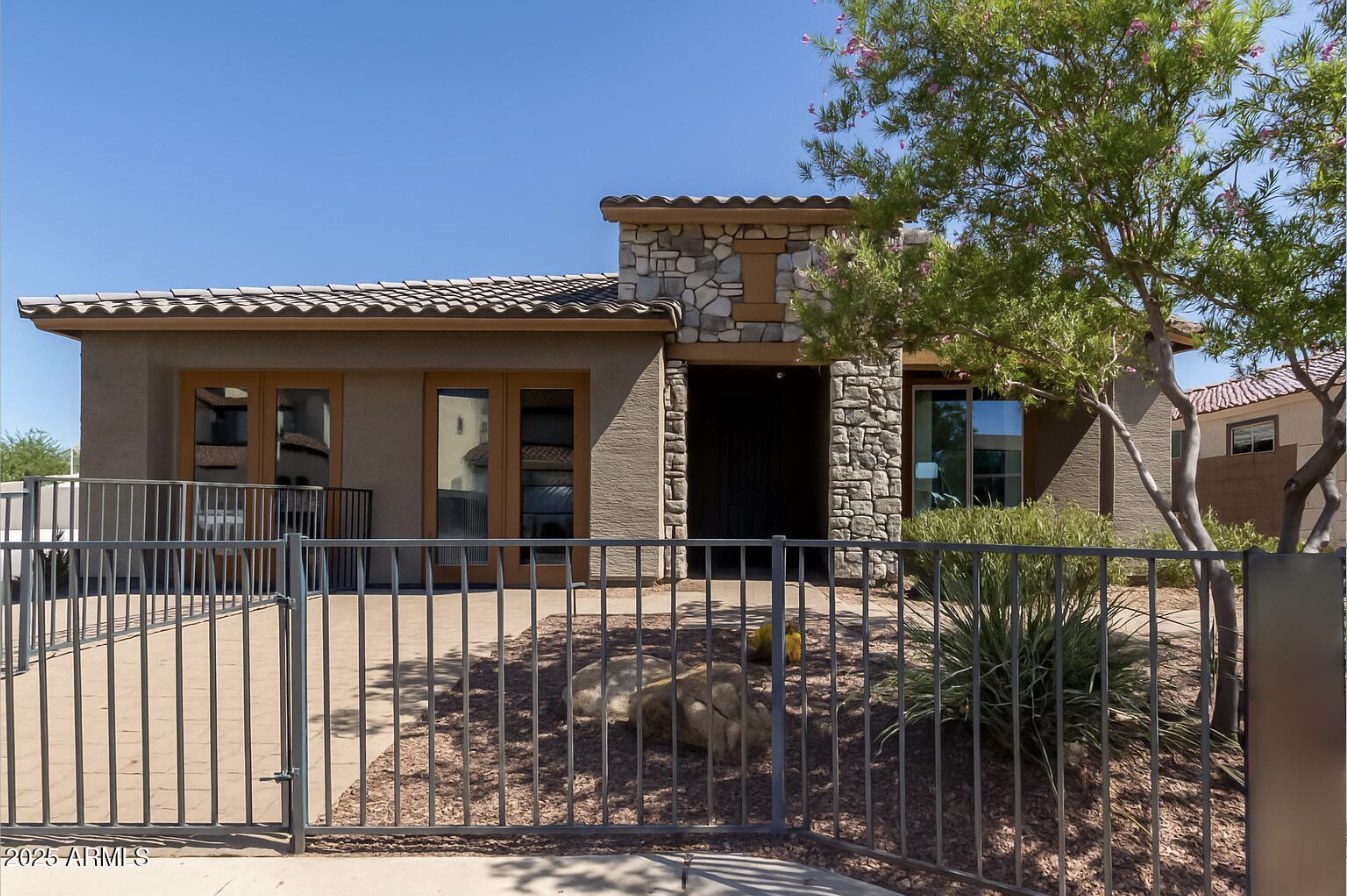 Front exterior with stone accents at 5404 W Sweet Pea Terrace, Laveen