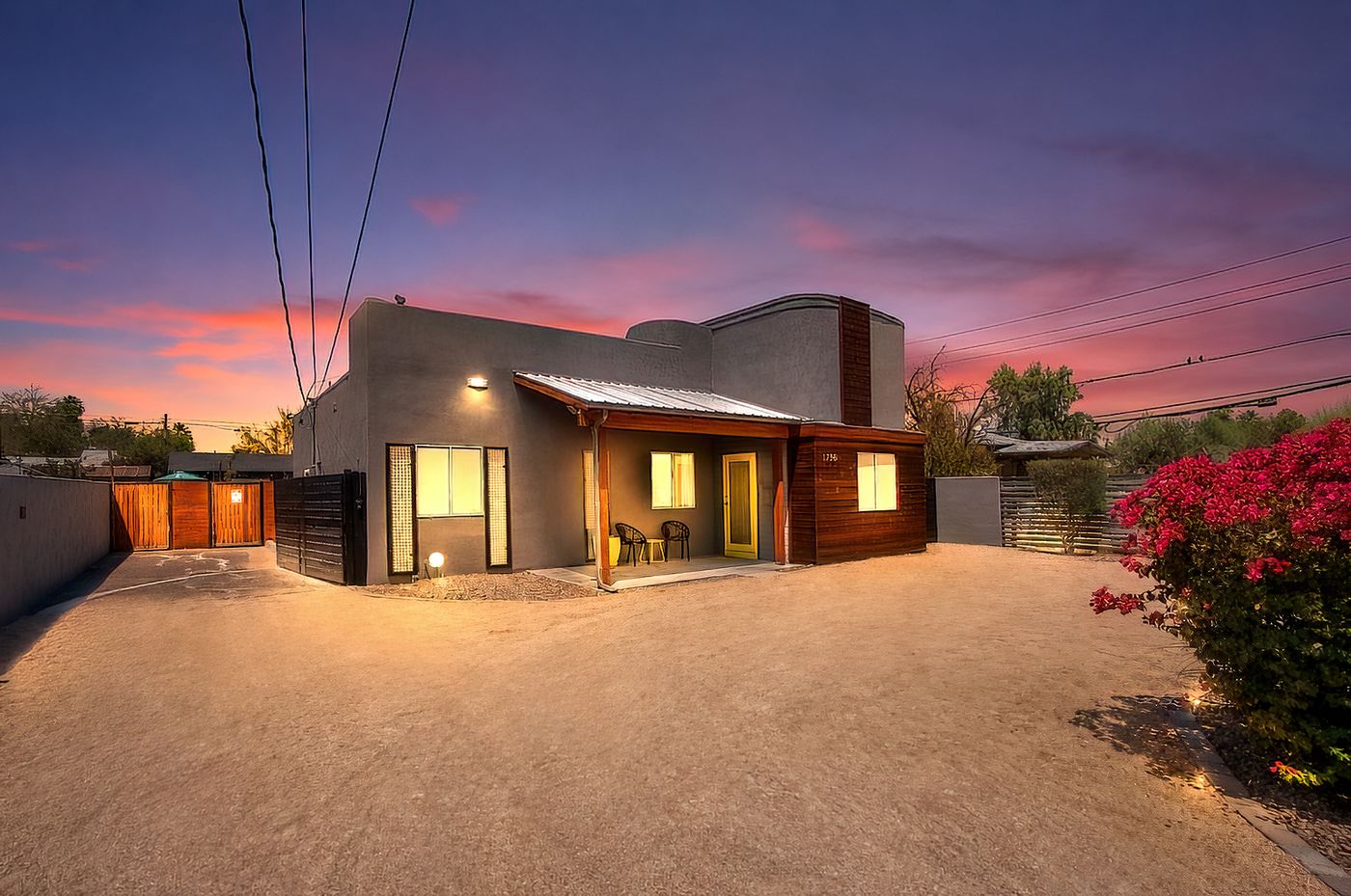 Loft-style living area with cactus wall art and PHOENIX AZ sign at 1058 E Whitton Avenue