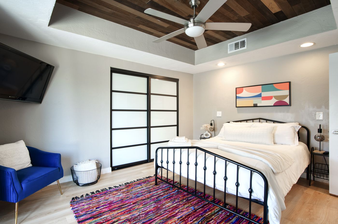 Two-story living room with spiral iron staircase and skylights at 1058 E Whitton Avenue