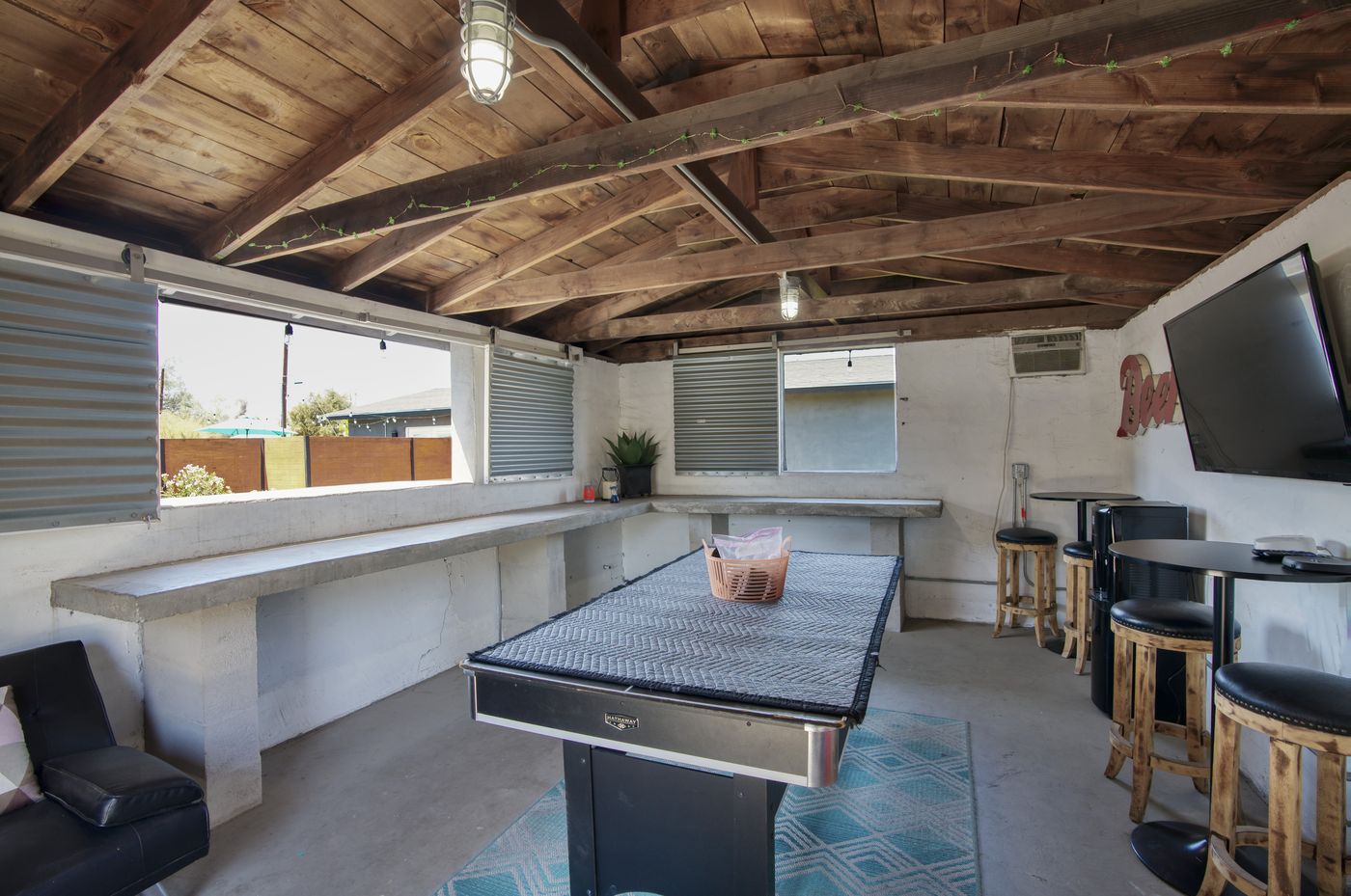 Industrial-style kitchen with concrete countertop island at 1058 E Whitton Avenue