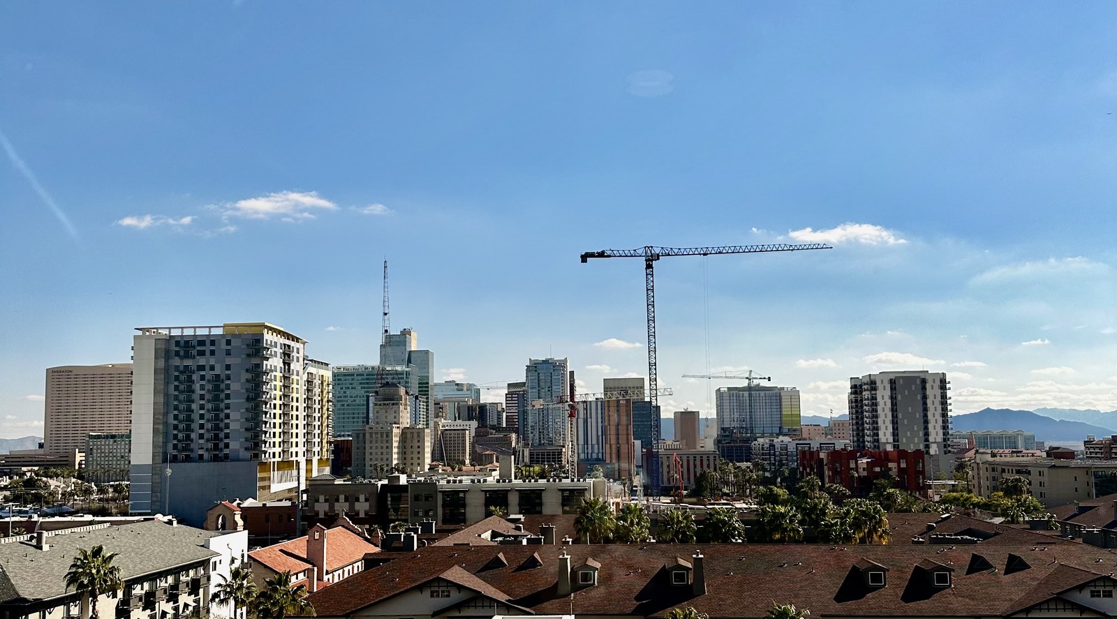 Downtown Phoenix skyline with a construction crane, a sign of the city's growth